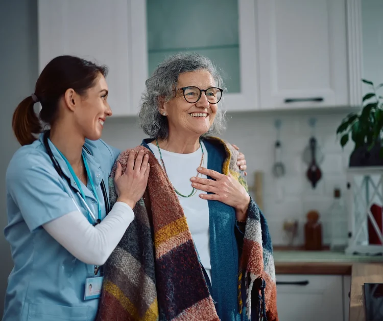 caring-nurse-embracing-senior-woman-during-a-home-2025-04-21-19-43-02-utc